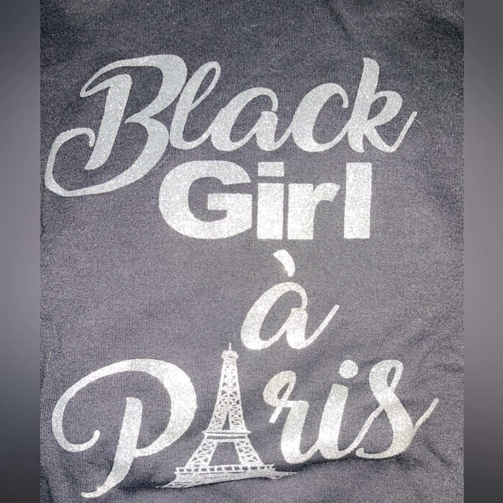 Black girl in Paris hoodie . Normal wear and tear in high traffic areas